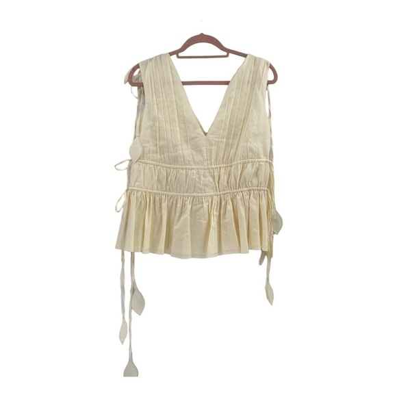 Tory Burch
Sleeveless Smocked Peplum Top COLOR New Ivory size 0 - Picture 10 of 17